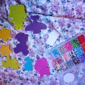 Perler Beads, wax paper, trays and thread